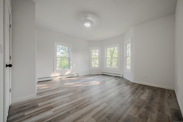 156 Waterville St, Waterbury, CT 06710 - unfurnished room with a baseboard heating unit, a ceiling fan, and wood finished floors
