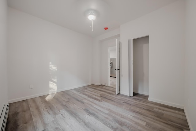 156 Waterville St, Waterbury, CT 06710 - unfurnished bedroom with wood finished floors and a baseboard radiator
