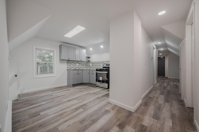 156 Waterville St, Waterbury, CT 06710 - kitchen featuring gray cabinetry, stainless steel gas stove, vaulted ceiling, light wood-style flooring, and light countertops