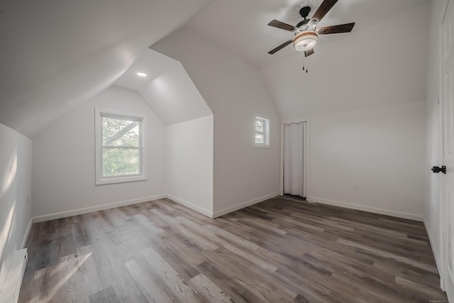 156 Waterville St, Waterbury, CT 06710 - additional living space with baseboard heating, healthy amount of natural light, a ceiling fan, vaulted ceiling, and wood finished floors