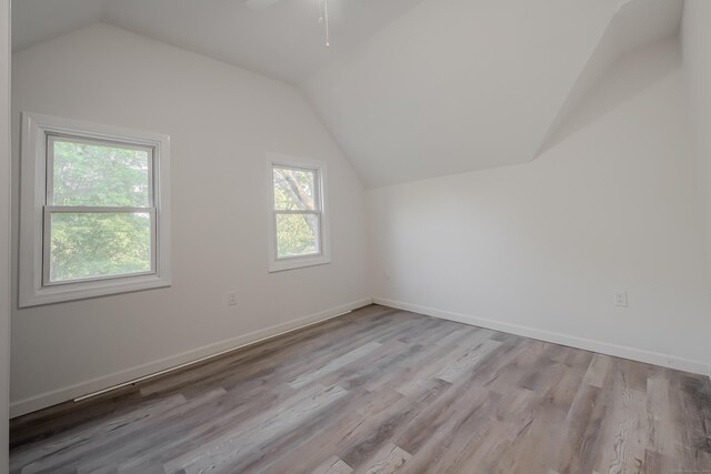 156 Waterville St, Waterbury, CT 06710 - additional living space with vaulted ceiling, healthy amount of natural light, and wood finished floors
