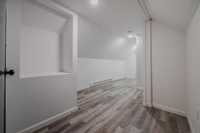 156 Waterville St, Waterbury, CT 06710 - additional living space featuring a baseboard heating unit, vaulted ceiling, and wood finished floors