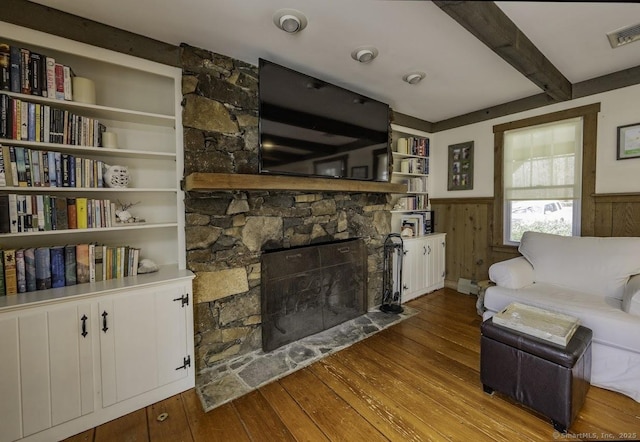 127 Skunk Misery Rd, Haddam, CT 06441 - living area featuring hardwood / wood-style flooring, wainscoting, a fireplace, and beam ceiling