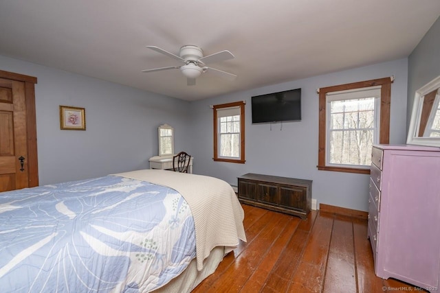 127 Skunk Misery Rd, Haddam, CT 06441 - bedroom with wood-type flooring, multiple windows, and a ceiling fan