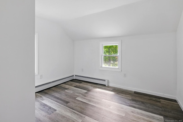 971 New Litchfield St, Torrington, CT 06790 - spare room featuring vaulted ceiling, a baseboard radiator, and wood finished floors
