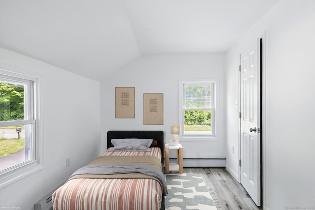 971 New Litchfield St, Torrington, CT 06790 - bedroom featuring baseboard heating, light wood-style flooring, and vaulted ceiling