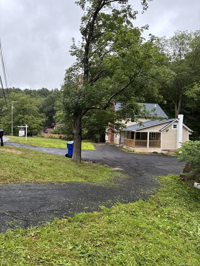 971 New Litchfield St, Torrington, CT 06790 - view of grassy yard with a porch