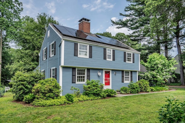 251 Ridgewood Rd, West Hartford, CT 06107 - colonial inspired home with a chimney, solar panels, and a front yard