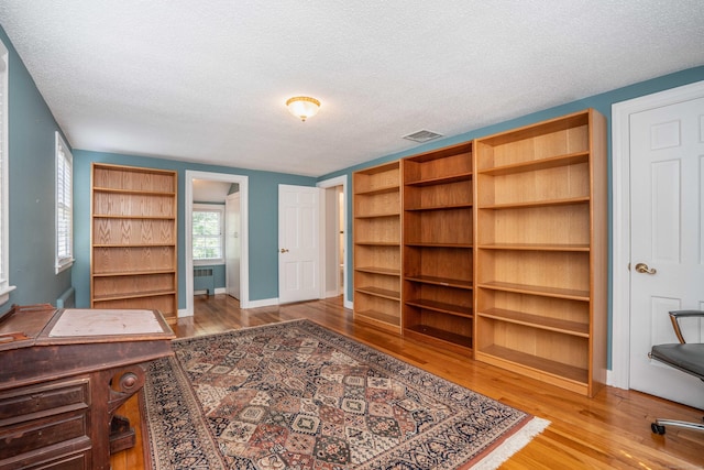 251 Ridgewood Rd, West Hartford, CT 06107 - unfurnished office with radiator, a textured ceiling, and wood finished floors