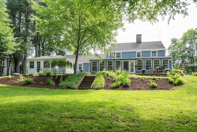 251 Ridgewood Rd, West Hartford, CT 06107 - rear view of property with a lawn, a chimney, and a gazebo