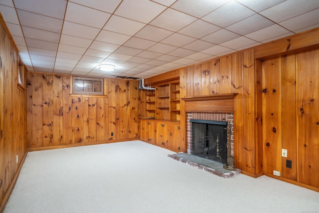 251 Ridgewood Rd, West Hartford, CT 06107 - finished below grade area featuring wooden walls, carpet, and a brick fireplace