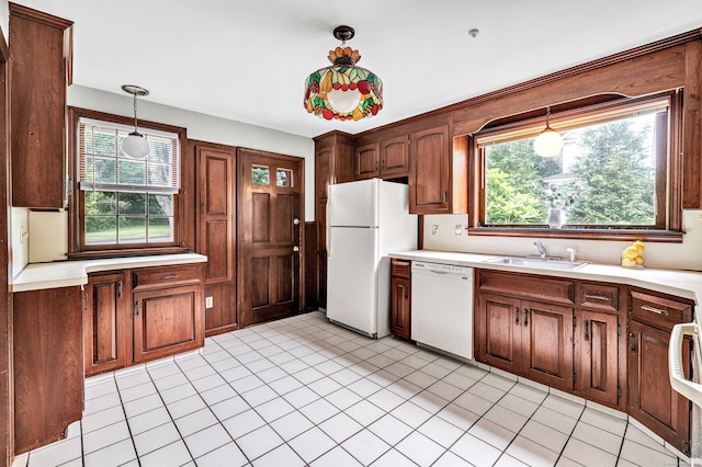 3 Wheeler Dr, Trumbull, CT 06611 - kitchen with white appliances, light countertops, hanging light fixtures, and light tile patterned flooring
