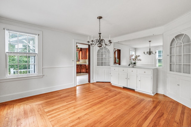3 Wheeler Dr, Trumbull, CT 06611 - unfurnished dining area with a chandelier, light wood finished floors, and ornamental molding