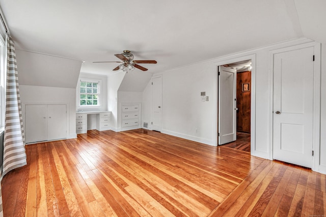 3 Wheeler Dr, Trumbull, CT 06611 - additional living space featuring light wood-style floors, a ceiling fan, built in study area, and vaulted ceiling