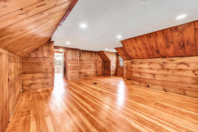 3 Wheeler Dr, Trumbull, CT 06611 - additional living space with wood walls, light wood-type flooring, and vaulted ceiling