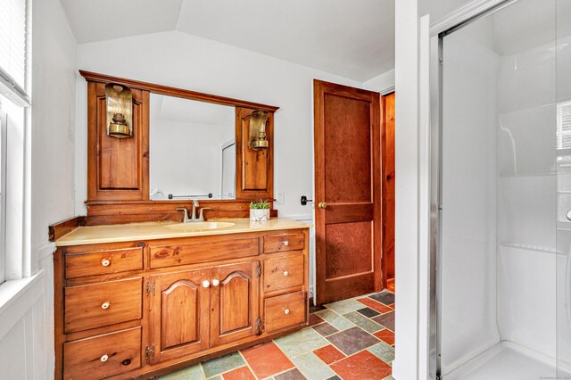 3 Wheeler Dr, Trumbull, CT 06611 - bathroom featuring vanity, a stall shower, stone finish floors, and vaulted ceiling