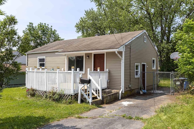 47 Manwaring Rd, Norwich, CT 06360 - view of front of house featuring a gate, a deck, and roof with shingles