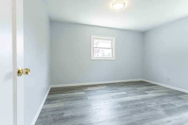 47 Manwaring Rd, Norwich, CT 06360 - empty room with wood finished floors and baseboards