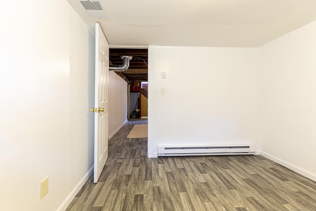 47 Manwaring Rd, Norwich, CT 06360 - unfurnished room featuring a baseboard radiator and wood finished floors