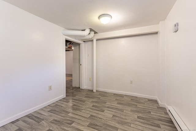 47 Manwaring Rd, Norwich, CT 06360 - unfurnished room with baseboard heating and wood finished floors