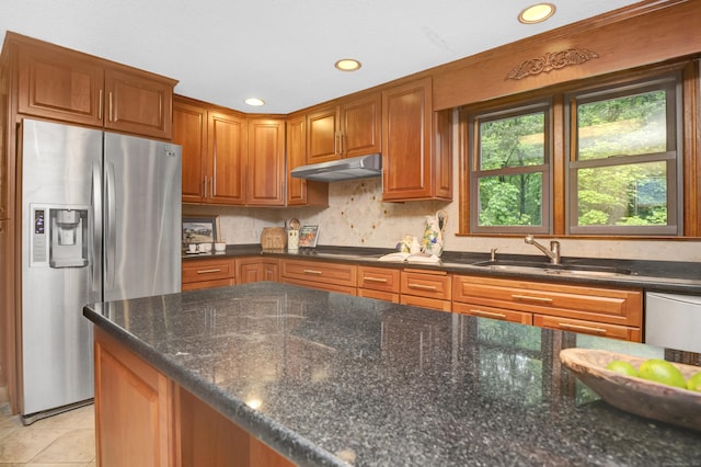 116 Bellridge Rd, Glastonbury, CT 06033 - kitchen featuring appliances with stainless steel finishes, under cabinet range hood, dark stone countertops, tasteful backsplash, and brown cabinets