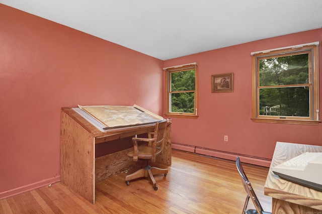 116 Bellridge Rd, Glastonbury, CT 06033 - office area featuring a baseboard heating unit, healthy amount of natural light, and light wood-type flooring