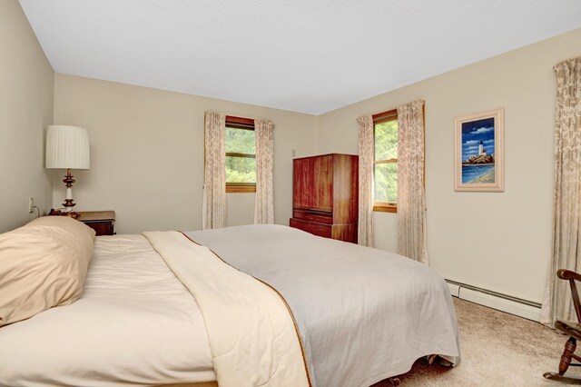 116 Bellridge Rd, Glastonbury, CT 06033 - bedroom with a baseboard radiator and light colored carpet