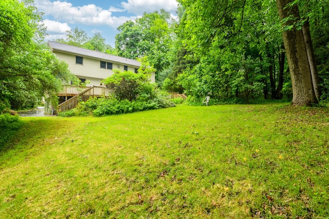 116 Bellridge Rd, Glastonbury, CT 06033 - view of grassy yard with stairs and a deck