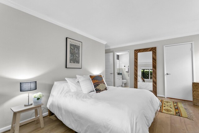 116 Southport Woods Dr, Fairfield, CT 06890 - bedroom featuring crown molding, wood finished floors, and ensuite bath