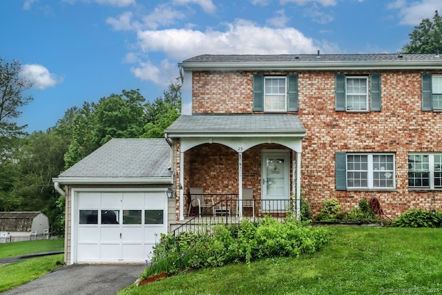 29 Whisconier Vlg Unit 29, Brookfield, CT 06804 - traditional-style home featuring a porch, an attached garage, a front yard, and brick siding