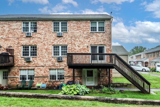 29 Whisconier Vlg Unit 29, Brookfield, CT 06804 - back of house featuring stairs, brick siding, and a deck