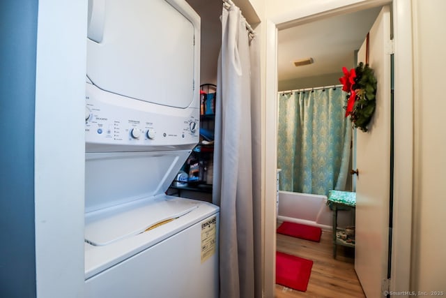 29 Whisconier Vlg Unit 29, Brookfield, CT 06804 - laundry area with stacked washer and clothes dryer and wood finished floors