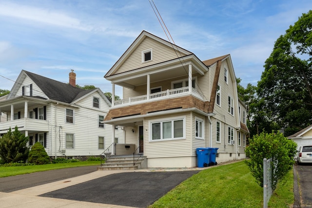 20 George St, Bristol, CT 06010 - view of front of house with a balcony, a front yard, and a gambrel roof