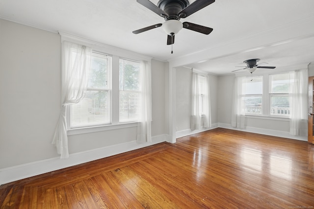 20 George St, Bristol, CT 06010 - empty room with healthy amount of natural light, wood finished floors, a ceiling fan, and crown molding
