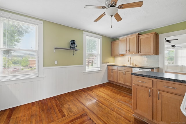 20 George St, Bristol, CT 06010 - kitchen featuring wainscoting, wood-type flooring, a ceiling fan, and dark countertops
