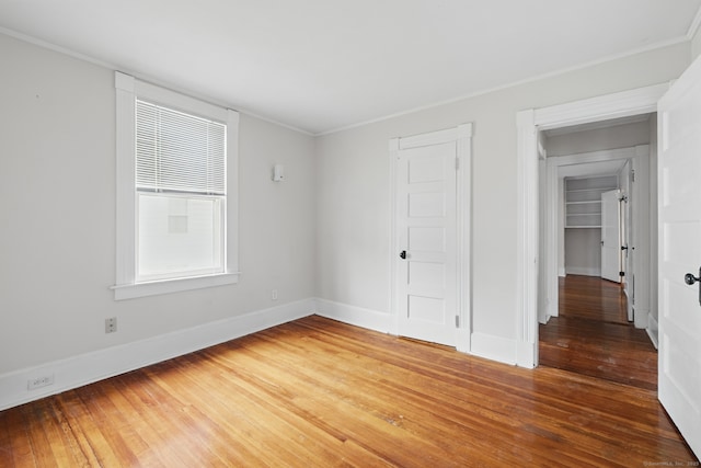 20 George St, Bristol, CT 06010 - unfurnished bedroom featuring wood-type flooring and ornamental molding