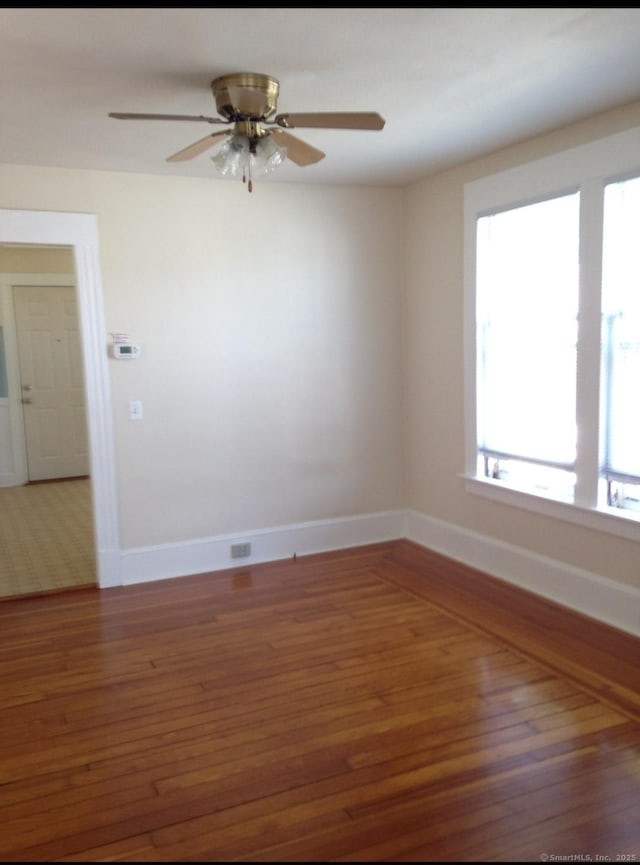 20 George St, Bristol, CT 06010 - unfurnished room with wood finished floors and a ceiling fan