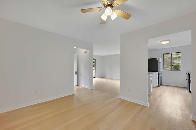 25 Florence Rd Unit 84, Branford, CT 06405 - unfurnished living room featuring light wood-type flooring and a ceiling fan