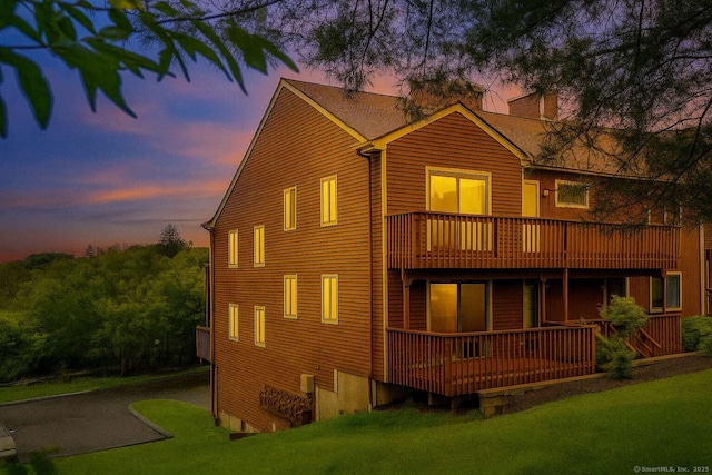 25 Florence Rd Unit 84, Branford, CT 06405 - view of front of house with a chimney, a yard, and a balcony