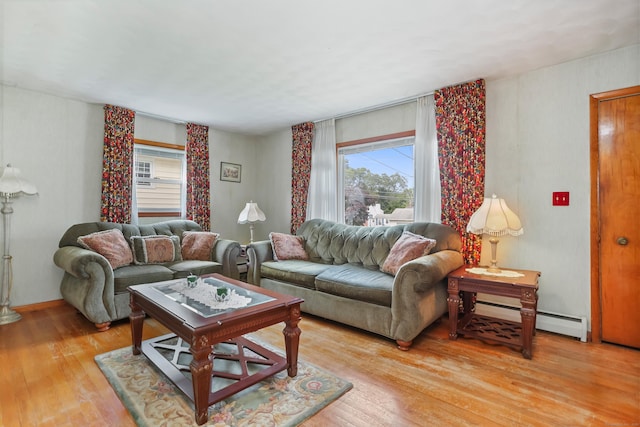 97 Travis Dr, Bridgeport, CT 06606 - living room with plenty of natural light, a baseboard heating unit, and light wood-style floors