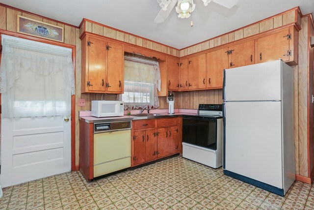 97 Travis Dr, Bridgeport, CT 06606 - kitchen featuring white appliances, brown cabinetry, a ceiling fan, and light floors
