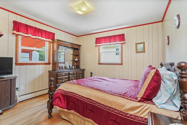 97 Travis Dr, Bridgeport, CT 06606 - bedroom with a baseboard heating unit, wood finished floors, and crown molding