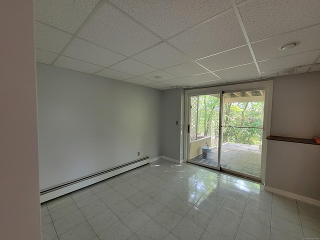 12 Enrico Rd, Bolton, CT 06043 - unfurnished room featuring baseboard heating, a drop ceiling, and tile patterned flooring