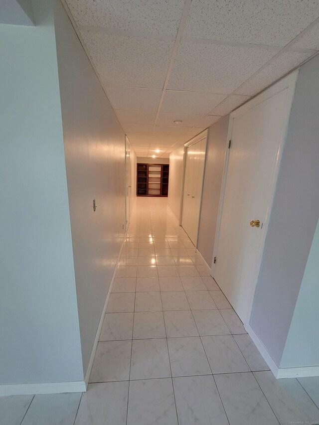 12 Enrico Rd, Bolton, CT 06043 - hallway featuring a paneled ceiling and baseboards