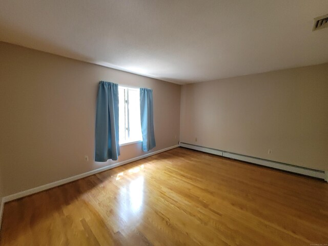 12 Enrico Rd, Bolton, CT 06043 - unfurnished room featuring a baseboard radiator and light wood-style floors
