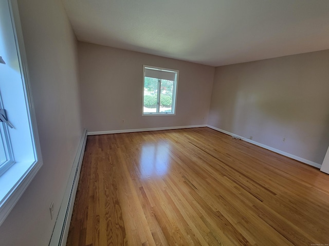 12 Enrico Rd, Bolton, CT 06043 - unfurnished room featuring baseboard heating and light wood-style floors