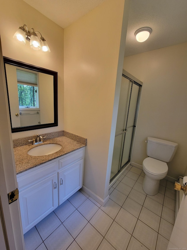 12 Enrico Rd, Bolton, CT 06043 - full bathroom featuring tile patterned floors, vanity, a shower stall, and a textured ceiling