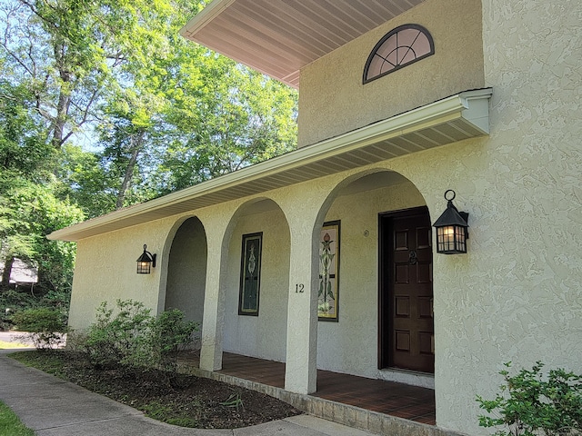 12 Enrico Rd, Bolton, CT 06043 - entrance to property featuring stucco siding and a porch