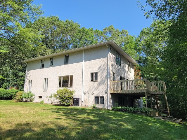 12 Enrico Rd, Bolton, CT 06043 - back of property featuring stucco siding, stairs, a lawn, and a deck