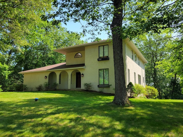 12 Enrico Rd, Bolton, CT 06043 - view of front of property featuring stucco siding and a front yard